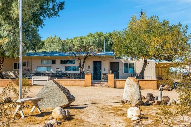 view of front of property featuring stucco siding