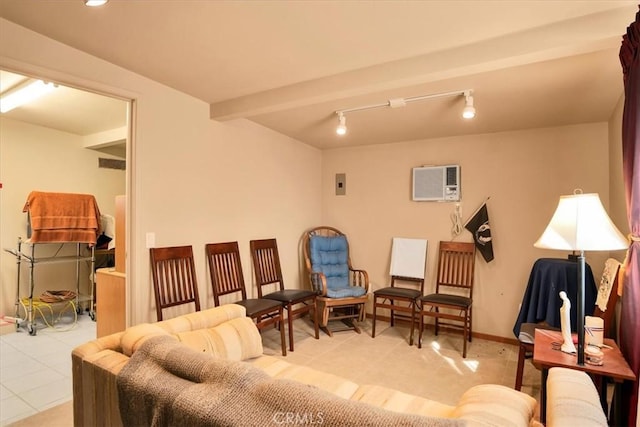 interior space with baseboards, a wall unit AC, beamed ceiling, rail lighting, and light tile patterned flooring