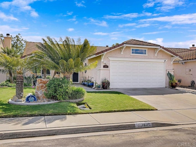 view of front of home featuring a tile roof, stucco siding, an attached garage, a front yard, and driveway