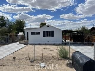 view of front of home featuring fence