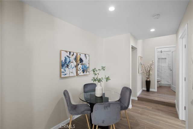 dining room featuring recessed lighting, baseboards, and wood finished floors