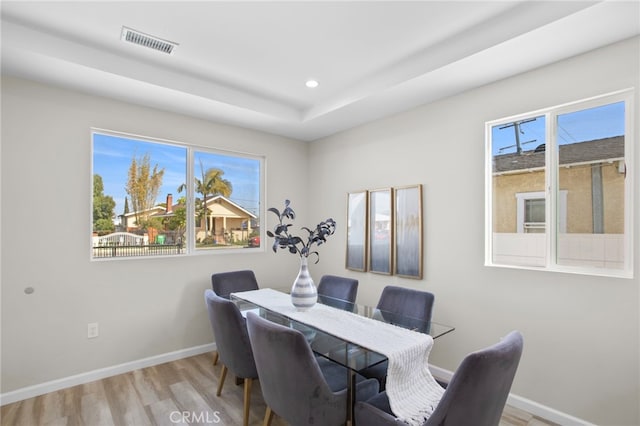 dining space with recessed lighting, wood finished floors, visible vents, and baseboards