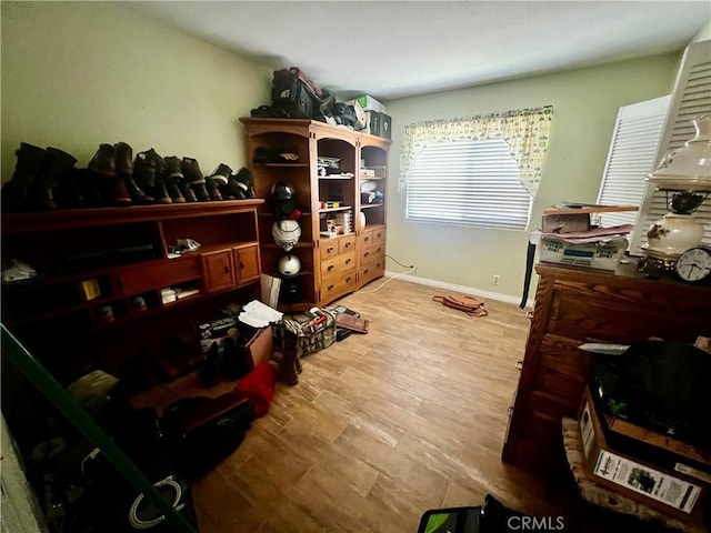 interior space with light wood-style flooring and baseboards