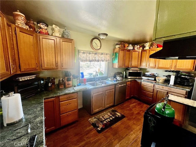 kitchen with dark wood finished floors, brown cabinets, stainless steel appliances, ventilation hood, and a sink