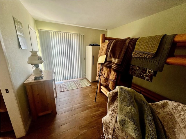 sitting room featuring dark wood-style floors