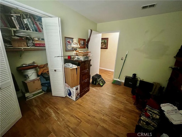 office area featuring wood finished floors and visible vents