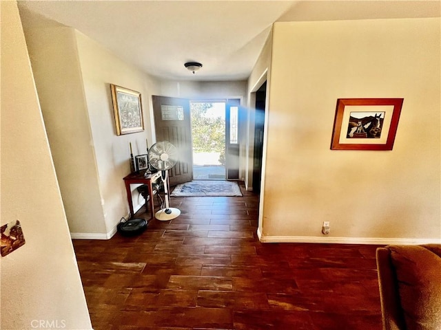 interior space with dark wood-style floors and baseboards