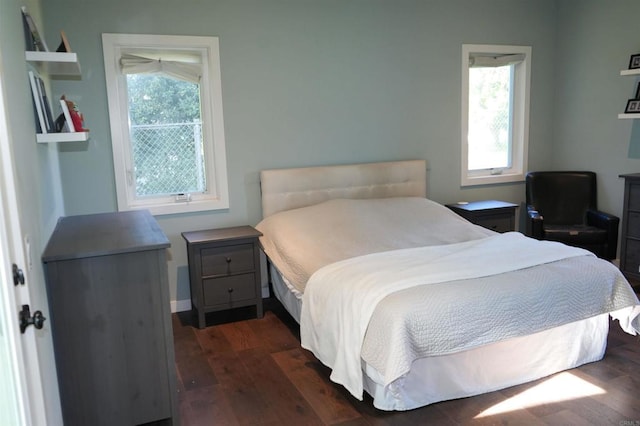 bedroom featuring dark wood-type flooring