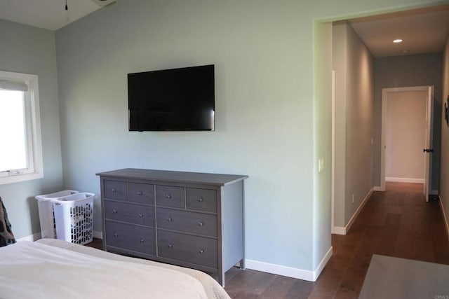 bedroom featuring recessed lighting, dark wood-style flooring, and baseboards