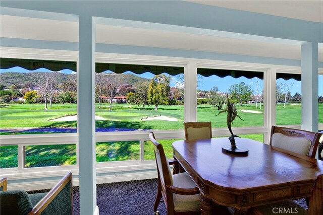 sunroom featuring a mountain view