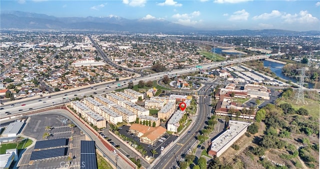 birds eye view of property featuring a view of city and a mountain view