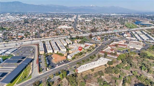 birds eye view of property with a mountain view