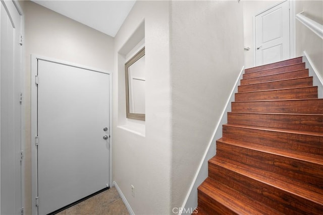 stairs featuring baseboards