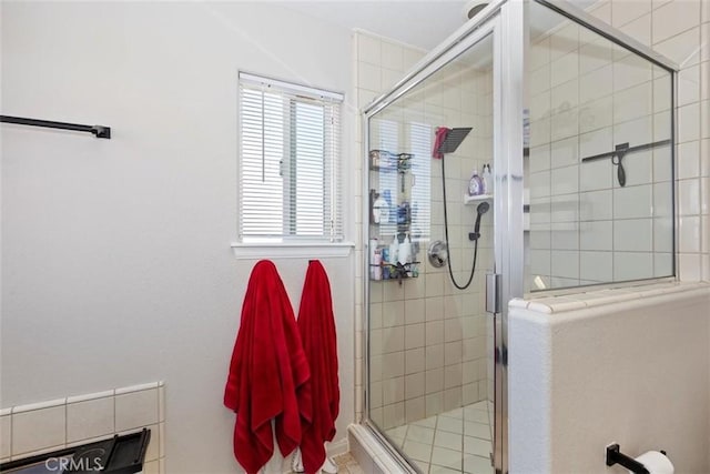 bathroom with a shower stall