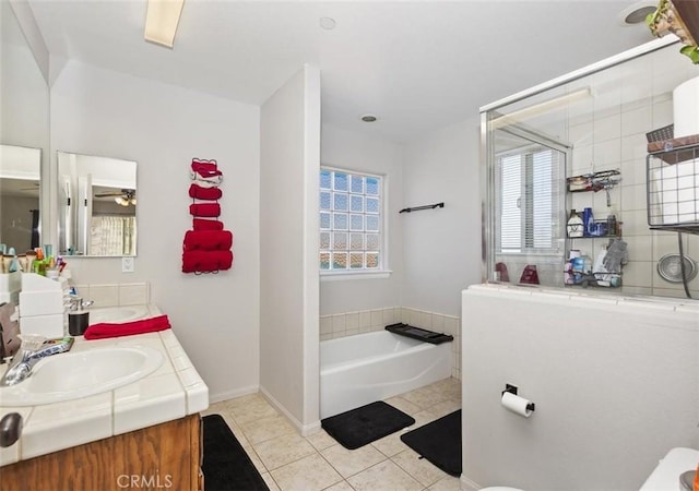 full bath with a garden tub, decorative backsplash, a sink, tile patterned flooring, and plenty of natural light