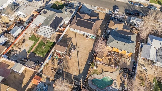 birds eye view of property with a residential view