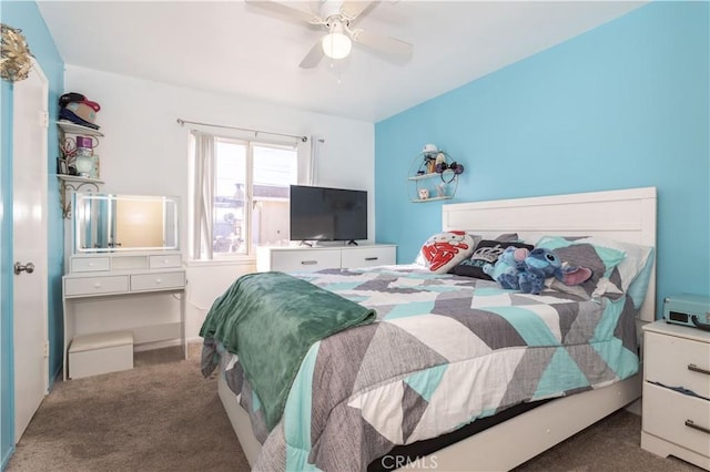 bedroom featuring ceiling fan and dark colored carpet