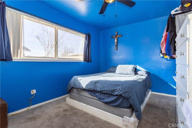 bedroom with carpet, a ceiling fan, and baseboards