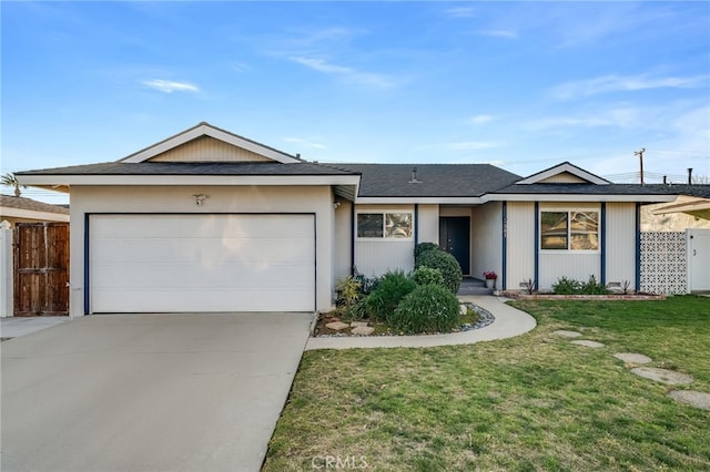 single story home featuring an attached garage, driveway, fence, and a front lawn