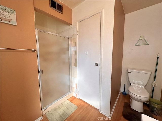 19863 Drasin Dr, Canyon Country, CA 91351 - bathroom with baseboards, visible vents, toilet, wood finished floors, and a shower stall