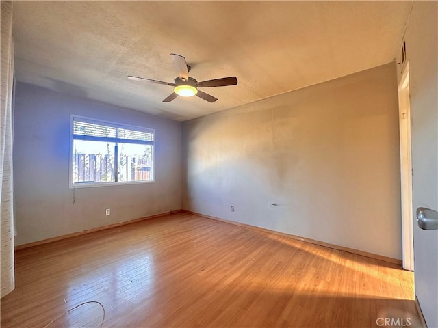 19863 Drasin Dr, Canyon Country, CA 91351 - empty room with ceiling fan, wood finished floors, and baseboards