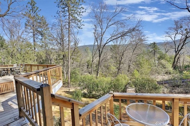 wooden terrace featuring outdoor dining area