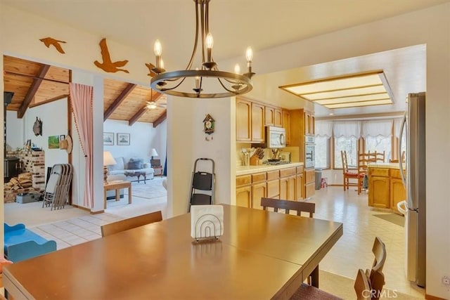 dining area with lofted ceiling with beams, wood ceiling, and an inviting chandelier
