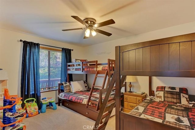 bedroom featuring light carpet and ceiling fan