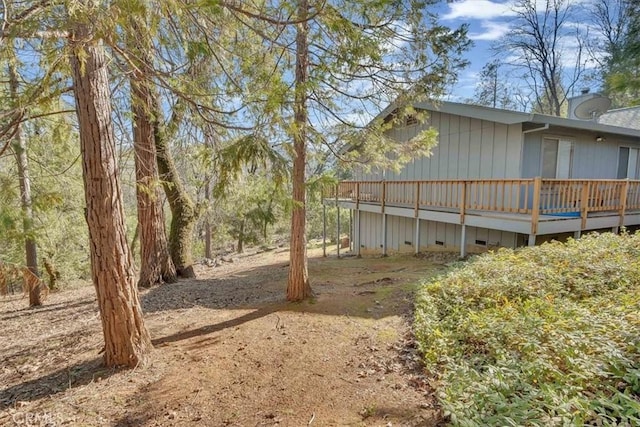 view of yard featuring a wooden deck