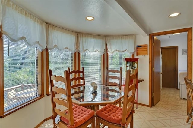 dining room featuring recessed lighting, baseboards, and light floors