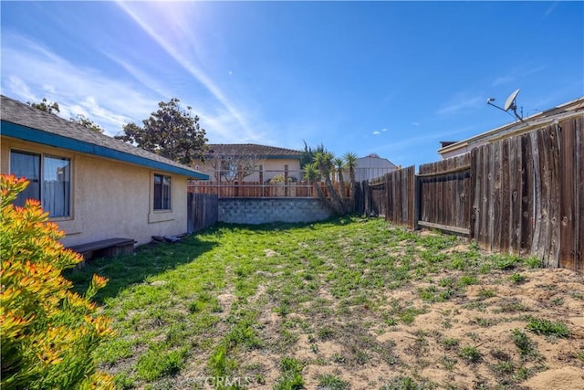 view of yard featuring a fenced backyard