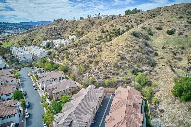 birds eye view of property with a mountain view and a residential view