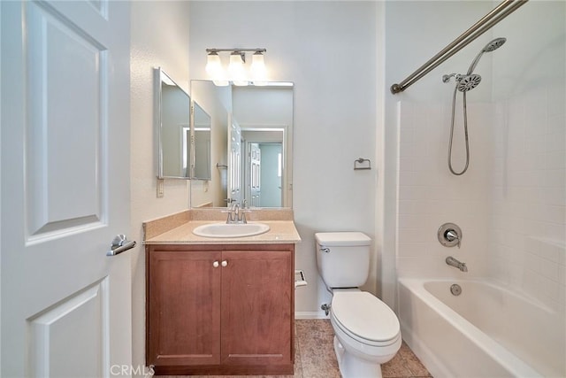 bathroom featuring washtub / shower combination, vanity, and toilet