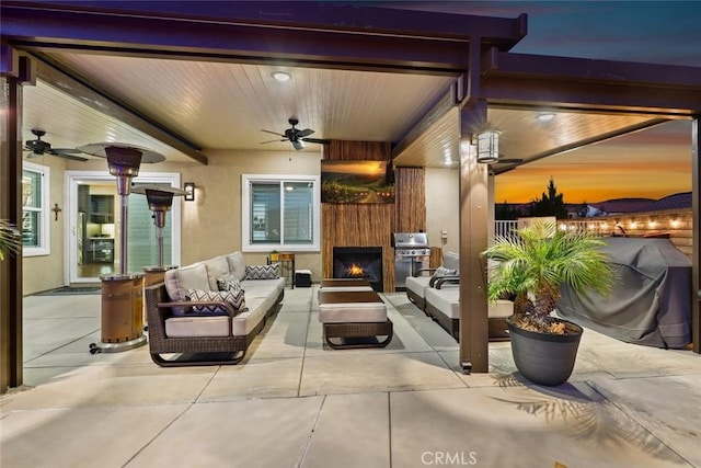 view of patio / terrace featuring grilling area, outdoor lounge area, and a ceiling fan