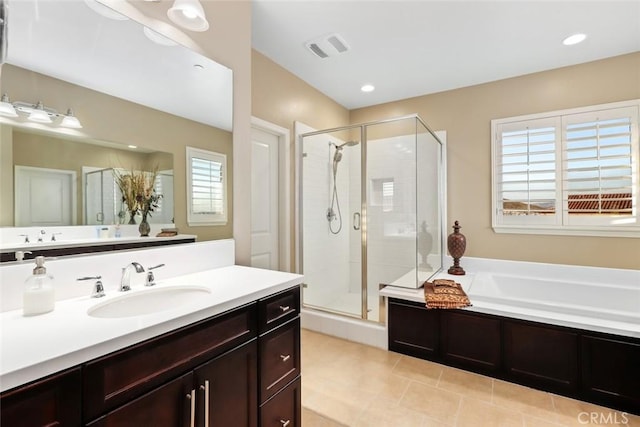 bathroom featuring visible vents, a garden tub, a shower stall, and vanity