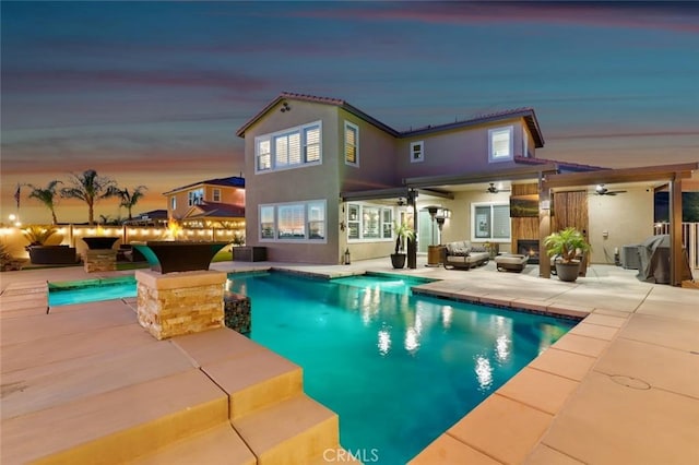 pool featuring a patio area, ceiling fan, an outdoor living space, and fence