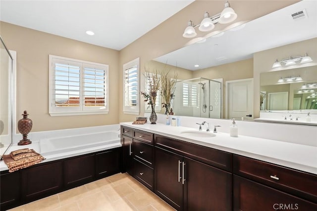 full bathroom featuring tile patterned flooring, a garden tub, vanity, visible vents, and a stall shower