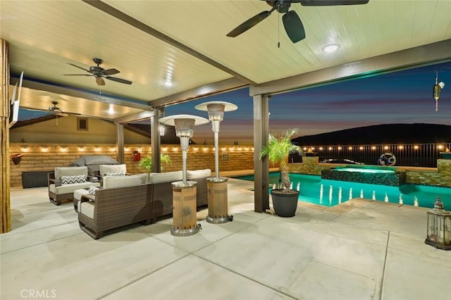 view of patio with fence private yard, a pool with connected hot tub, outdoor lounge area, and ceiling fan