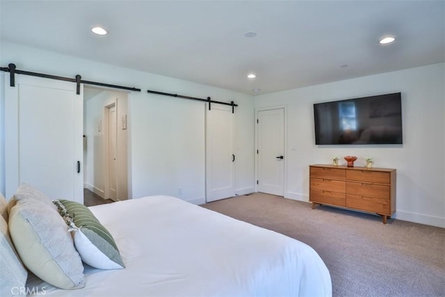 28622 Shenandoah Dr, Lake Arrowhead, CA 92352 - carpeted bedroom featuring a barn door, baseboards, and recessed lighting