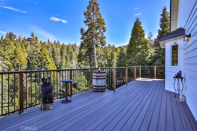 28622 Shenandoah Dr, Lake Arrowhead, CA 92352 - wooden deck featuring a wooded view