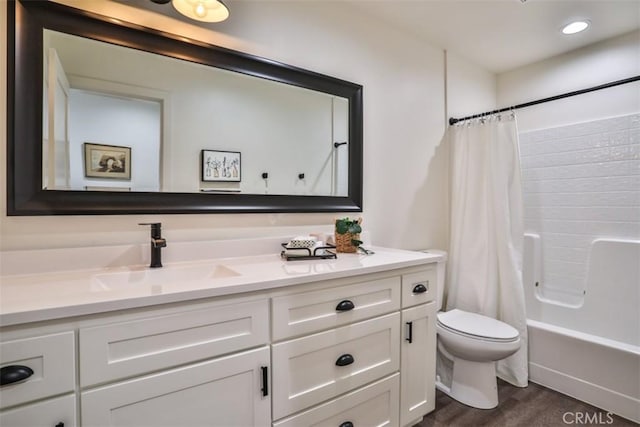 28622 Shenandoah Dr, Lake Arrowhead, CA 92352 - bathroom with vanity, toilet, wood finished floors, shower / bath combo, and recessed lighting