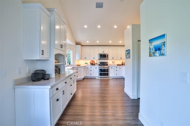 28622 Shenandoah Dr, Lake Arrowhead, CA 92352 - kitchen featuring appliances with stainless steel finishes, dark wood finished floors, light countertops, white cabinets, and recessed lighting