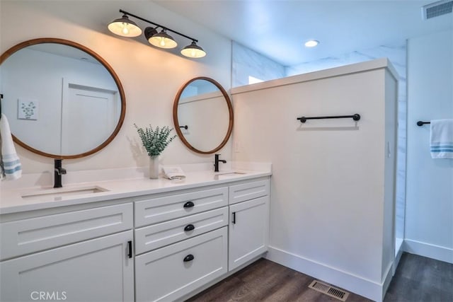 28622 Shenandoah Dr, Lake Arrowhead, CA 92352 - full bathroom featuring wood finished floors, baseboards, and double vanity