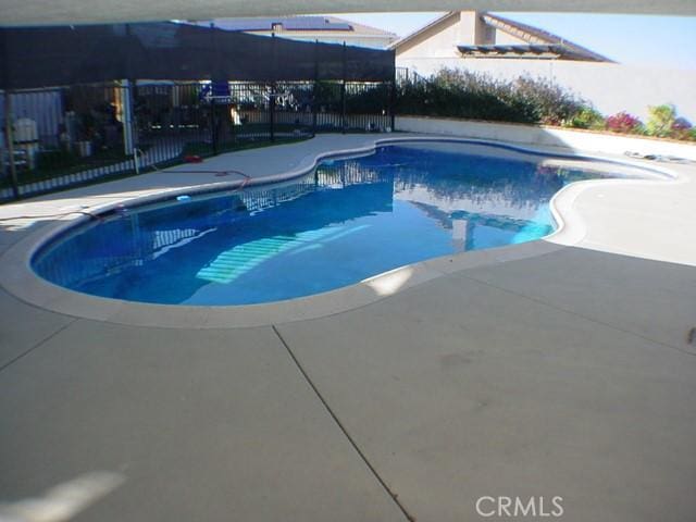 view of pool with a patio, fence, and a fenced in pool