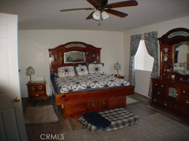 bedroom with dark wood finished floors and a ceiling fan