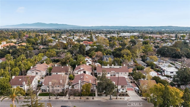 birds eye view of property with a residential view and a mountain view