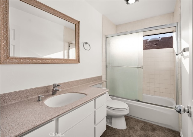 full bath featuring toilet, vanity, and shower / bath combination with glass door