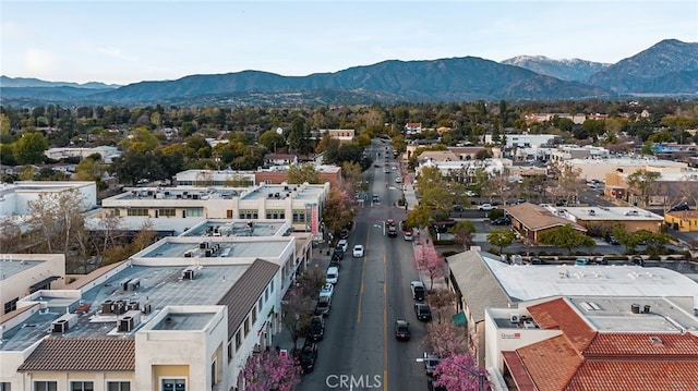 birds eye view of property with a mountain view