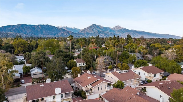 birds eye view of property with a mountain view and a residential view