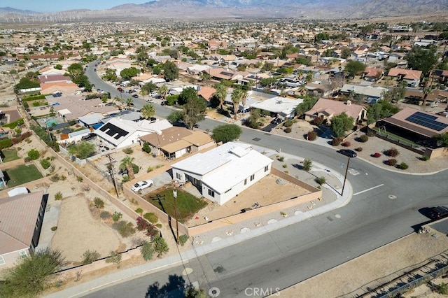 birds eye view of property with a mountain view and a residential view